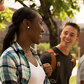 Two students walking on campus