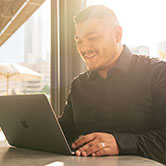 Student with a laptop studying