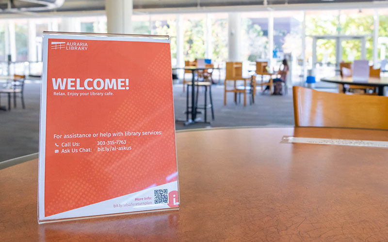 a Welcome sign on a desk at the library