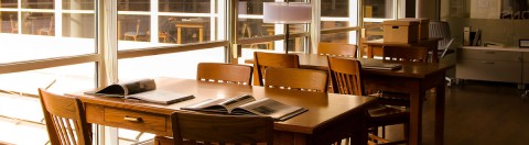 Image Source: Auraria Library books open on a table for viewing in the Reading Room
