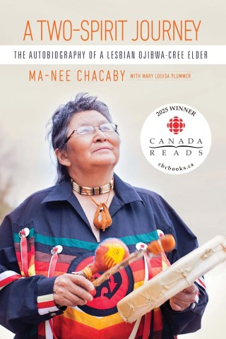 Cover of "A Two-Spirit Journey" showing an Indigenous elder, in traditional attire, joyfully playing a drum. The book is a winner of Canada Reads 2025.