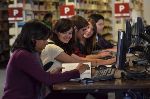 Preparing for finals? Auraria Library is here to support you! Students study in the Auraria Library, image source @ CU Digital Assets