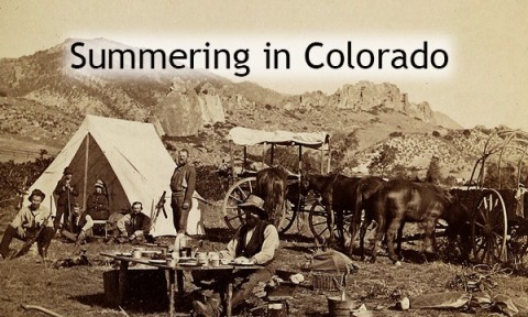 Historic photograph of a group of travelers in the Rocky Mountains