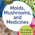 Book cover of "Molds, Mushrooms, and Medicines." Features colorful fungi images around a central white circle with the title. Scientific and engaging.