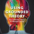 Silhouette of a human head with vibrant colors inside. A small figure stands on a path, facing the colors. Text: "Using Grounded Theory" by Helen Scott.